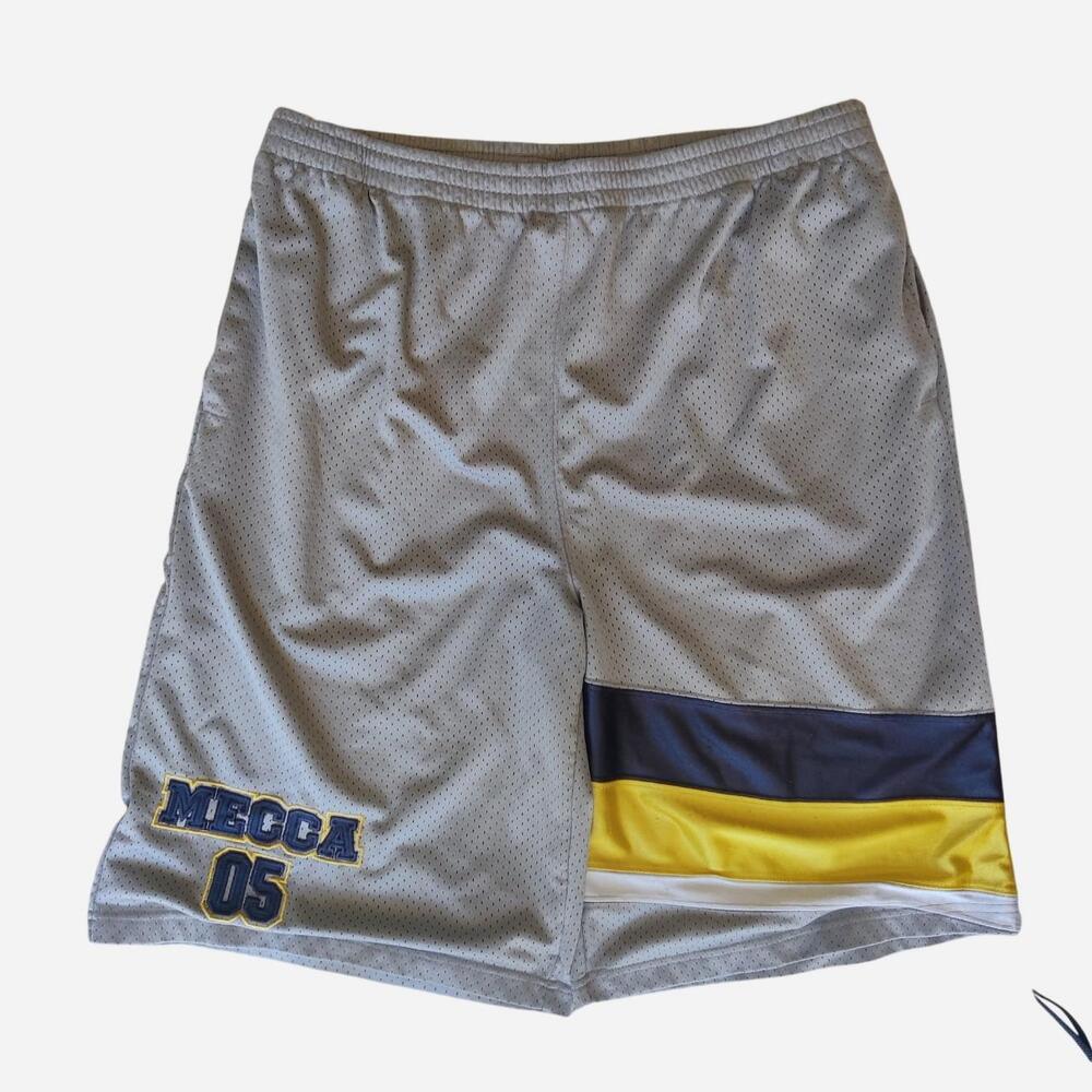 Y2K Mecca baggy basketball gray shorts with yellow, white, and navy blue vertica